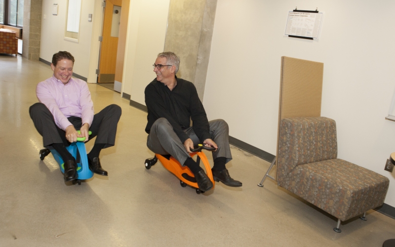 Executive Director Tom Keegan and Co-Director Nicholas Christakis&nbsp;race PlasmaCars, which are self-powered, and used to study defector networks.